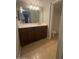 Bathroom featuring a vanity with a white countertop and dark brown cabinets at 2625 E Indian School Rd # 335, Phoenix, AZ 85016