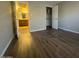 Bedroom leading to bathroom and closet, featuring wood flooring at 2625 E Indian School Rd # 335, Phoenix, AZ 85016