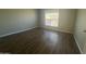 Bright bedroom with wood floors and a window bringing in natural light at 2625 E Indian School Rd # 335, Phoenix, AZ 85016