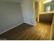 A cozy room with wood flooring, neutral walls, and lots of sunlight at 2625 E Indian School Rd # 335, Phoenix, AZ 85016