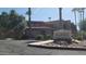 Biltmore Promenade Condominium sign with lush landscaping and mature trees at 2625 E Indian School Rd # 335, Phoenix, AZ 85016