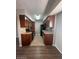 Functional kitchen featuring dark wood cabinets, granite countertops and stainless steel appliances at 2625 E Indian School Rd # 335, Phoenix, AZ 85016
