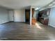 Open-concept living area with a view into the kitchen featuring stainless steel appliances at 2625 E Indian School Rd # 335, Phoenix, AZ 85016
