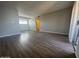 Large living room area showcasing wood flooring and a sliding glass door at 2625 E Indian School Rd # 335, Phoenix, AZ 85016