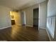 Bright bedroom featuring wood flooring, closet space and a bathroom at 2625 E Indian School Rd # 335, Phoenix, AZ 85016