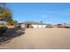 Detached garage with multiple bays and large gravel parking area at 2718 E Campo Bello Dr, Phoenix, AZ 85032
