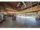 Spacious garage with workshop area, high ceilings, and convenient garage door access at 2718 E Campo Bello Dr, Phoenix, AZ 85032