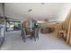 Spacious living room with large windows, dining table, and a comfortable seating area, creating an ideal place to relax at 2718 E Campo Bello Dr, Phoenix, AZ 85032