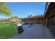 Outdoor kitchen and patio area perfect for grilling and entertaining, with a large grassy backyard at 2718 E Campo Bello Dr, Phoenix, AZ 85032