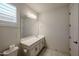 Well-lit bathroom features a sleek vanity with modern fixtures and a large mirror at 3548 E Tina Dr, Phoenix, AZ 85050