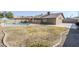 Home's backyard features a large grass area, fenced pool, and concrete patio at 3632 W Kelton Ln, Phoenix, AZ 85053