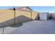 Spacious backyard featuring a concrete surface and block wall fencing at 3632 W Kelton Ln, Phoenix, AZ 85053