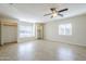 Large bedroom with tile flooring, neutral walls, and two closets provides ample space and storage at 3632 W Kelton Ln, Phoenix, AZ 85053