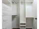 Organized walk-in closet with custom shelving and drawers for ample storage and organization at 3632 W Kelton Ln, Phoenix, AZ 85053