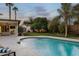 Lush backyard featuring a beautiful pool area and a covered patio at 3640 E Fairmount Ave, Phoenix, AZ 85018