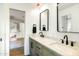 Modern bathroom features a double sink vanity with marble countertop and black fixtures at 3640 E Fairmount Ave, Phoenix, AZ 85018