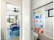 Modern bathroom features a shower with a colorful curtain and tiled walls at 3640 E Fairmount Ave, Phoenix, AZ 85018