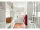 Bright laundry room with ample shelving, red washer/dryer, and tiled floor at 3640 E Fairmount Ave, Phoenix, AZ 85018