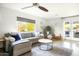 Comfortable living room with a sectional sofa, accent chair, and bright natural light at 3640 E Fairmount Ave, Phoenix, AZ 85018