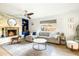 Cozy living room with a stone fireplace, custom built-ins, and comfortable sectional sofa at 3640 E Fairmount Ave, Phoenix, AZ 85018