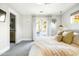 Well-lit main bedroom with a plush bed, ensuite bathroom, and views of the pool at 3640 E Fairmount Ave, Phoenix, AZ 85018