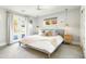 Spacious main bedroom with a king-size bed, ensuite bathroom, and natural light at 3640 E Fairmount Ave, Phoenix, AZ 85018