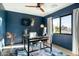 Stylish office with a modern desk, ample natural light, and dark blue accent wall at 3640 E Fairmount Ave, Phoenix, AZ 85018