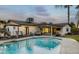 Beautiful pool area with lounge chairs, patio umbrella, and outdoor seating at 3640 E Fairmount Ave, Phoenix, AZ 85018