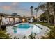 Gorgeous swimming pool with diving board surrounded by lush landscaping and lounge chairs at 3640 E Fairmount Ave, Phoenix, AZ 85018