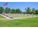 Outdoor amphitheater with tiered seating overlooking a green lawn, perfect for community events at 4064 E Morrison Ranch Pkwy, Gilbert, AZ 85296
