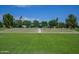 Outdoor amphitheater showcasing the United States and Arizona flags, set against a backdrop of lush trees at 4064 E Morrison Ranch Pkwy, Gilbert, AZ 85296