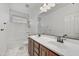 Bathroom with double sinks, large mirror, and a combined tub and shower at 4064 E Morrison Ranch Pkwy, Gilbert, AZ 85296
