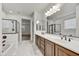Bright bathroom with a double sink vanity, large mirror, and separate tub and shower at 4064 E Morrison Ranch Pkwy, Gilbert, AZ 85296