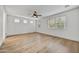 Spacious primary bedroom features wood floors and many windows at 4064 E Morrison Ranch Pkwy, Gilbert, AZ 85296