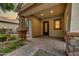 Inviting covered front porch features stone pillars and brick pavers at 4064 E Morrison Ranch Pkwy, Gilbert, AZ 85296