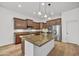 Elegant kitchen with a central island and stainless steel appliances at 4064 E Morrison Ranch Pkwy, Gilbert, AZ 85296