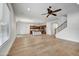 Bright, open living room featuring wood floors and a staircase at 4064 E Morrison Ranch Pkwy, Gilbert, AZ 85296