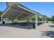 Spacious covered picnic area with multiple picnic tables, providing a comfortable outdoor gathering spot at 4064 E Morrison Ranch Pkwy, Gilbert, AZ 85296