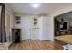 Open kitchen area leads to hallway and living room with view of backyard through sliding door at 414 W Piute Ave, Phoenix, AZ 85027