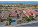 Aerial view of home with tile roof, solar panels, desert landscaping, and mountain views at 4182 N Potomac Dr, Florence, AZ 85132