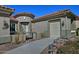 Beautiful home showcasing desert landscaping, a tile roof, and a charming entryway gate at 4182 N Potomac Dr, Florence, AZ 85132