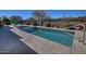 This backyard features a private pool area with clear water and a sleek design for outdoor relaxation at 4182 N Potomac Dr, Florence, AZ 85132