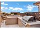 Outdoor kitchen featuring a built-in grill, counter space, and a bar seating area at 42189 W Cactus Flower Dr, Maricopa, AZ 85138