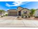 Charming single-story home with a two-car garage, landscaped front yard, and neutral-toned exterior at 4417 S 111Th Dr, Tolleson, AZ 85353