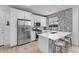 Modern kitchen featuring stainless steel appliances, a center island, and pendant lighting at 4417 S 111Th Dr, Tolleson, AZ 85353