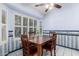 Charming dining area with a ceiling fan and bright window shutters at 4938 W Julie Dr, Glendale, AZ 85308