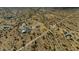 Expansive aerial view of desert properties and roads amidst the Arizona landscape at 53573 W Fresno Rd, Maricopa, AZ 85139
