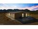 Exterior view featuring stunning mountain views, a covered patio, and ample space at 53573 W Fresno Rd, Maricopa, AZ 85139