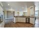 Bright kitchen featuring white cabinets, stainless steel dishwasher and decorative backsplash at 53573 W Fresno Rd, Maricopa, AZ 85139