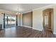 Bright living room with wood flooring and sliding glass doors to the backyard at 53573 W Fresno Rd, Maricopa, AZ 85139